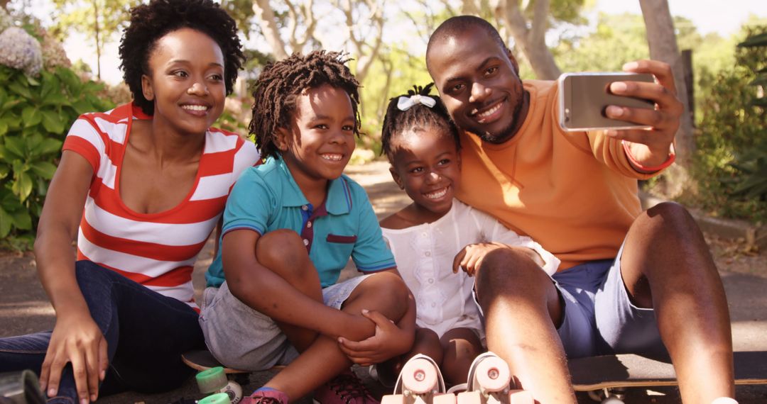 Happy African American Family Taking a Selfie in the Park - Free Images, Stock Photos and Pictures on Pikwizard.com