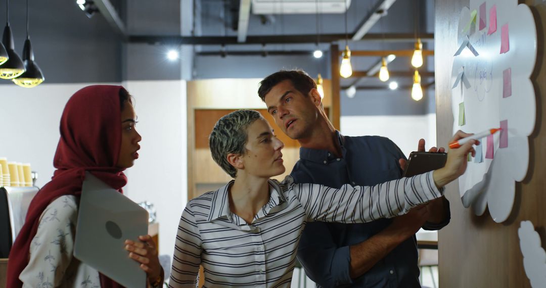 Creative Team Collaborative Brainstorming Session in Modern Cafe