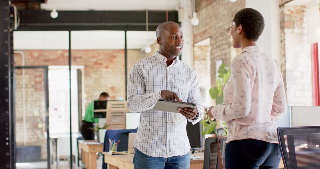 African American Professionals Collaborating in Modern Office Environment