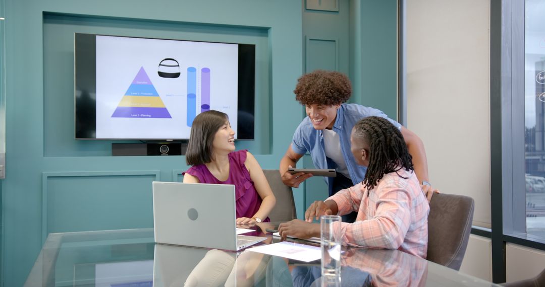 Diverse Team Collaborative Meeting with Technology in Modern Office