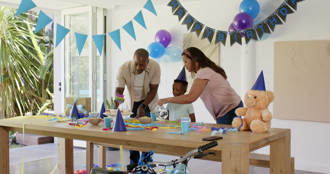 Diverse Family Arranging Birthday Celebration Table at Home