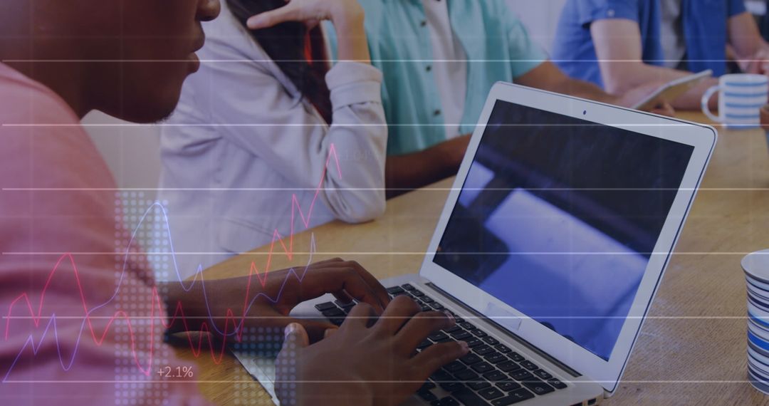 Data Analyst Working on Laptop With Overlayed Statistical Charts