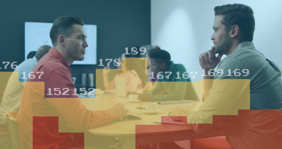 Two Professionals Analyzing Business Data in Modern Office