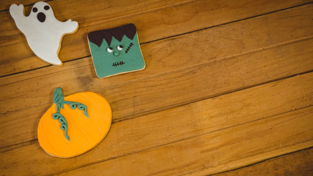 Halloween Cookies on Rustic Wood Surface Create Festive Atmosphere