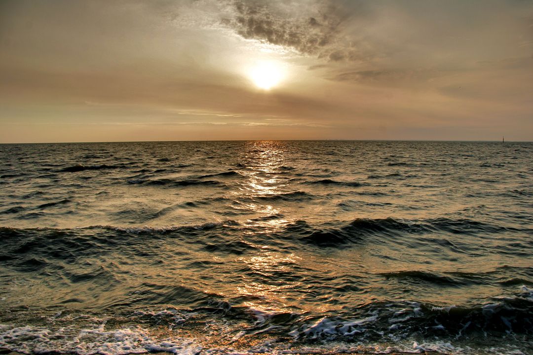 Tranquil Ocean Waves During Golden Sunset - Free Images, Stock Photos and Pictures on Pikwizard.com