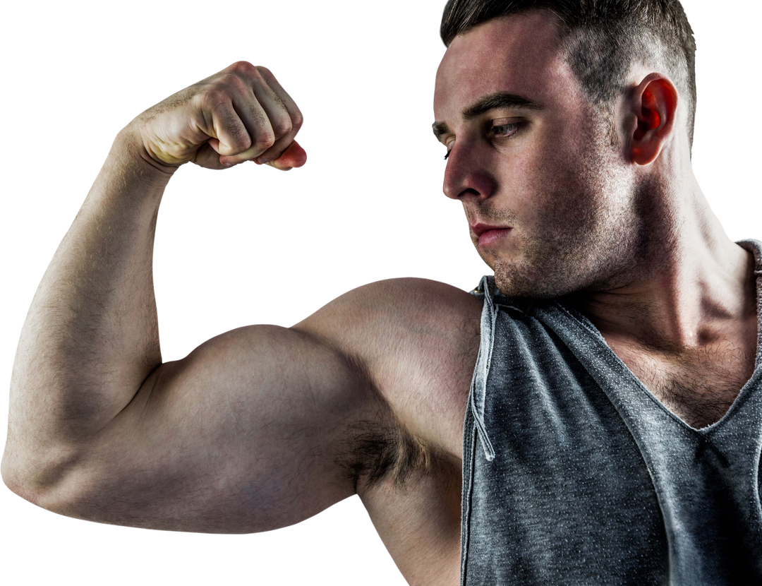 Muscular Young Man Flexing Bicep with Intense Expression - Download Free Stock Images Pikwizard.com