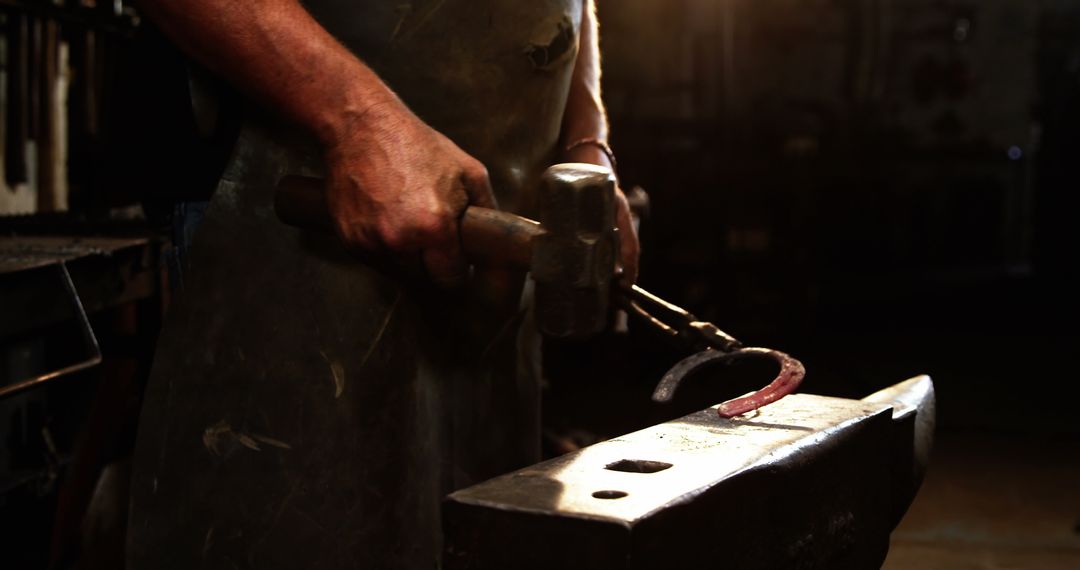 Blacksmith Crafting Horseshoe on Anvil