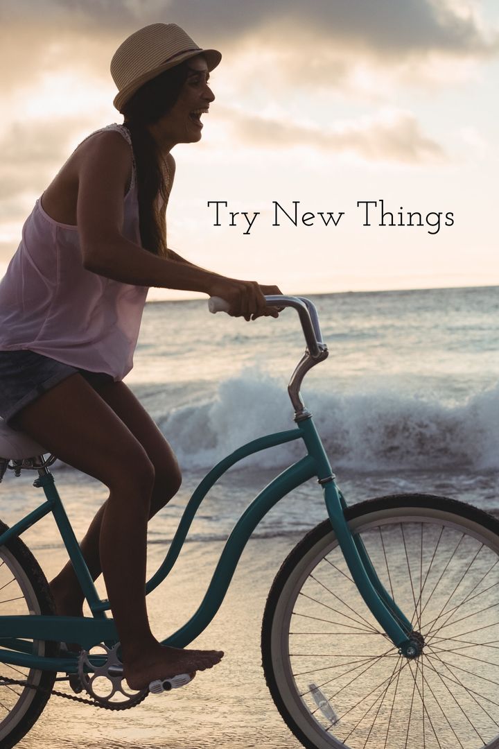Woman Joyfully Riding Bicycle During Beach Sunset Adventure
