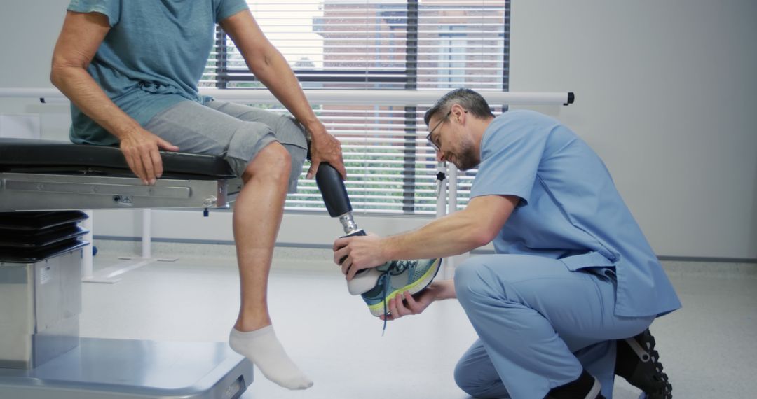 Physical Therapist Adjusting Prosthetic Leg for Patient in Medical Clinic - Free Images, Stock Photos and Pictures on Pikwizard.com