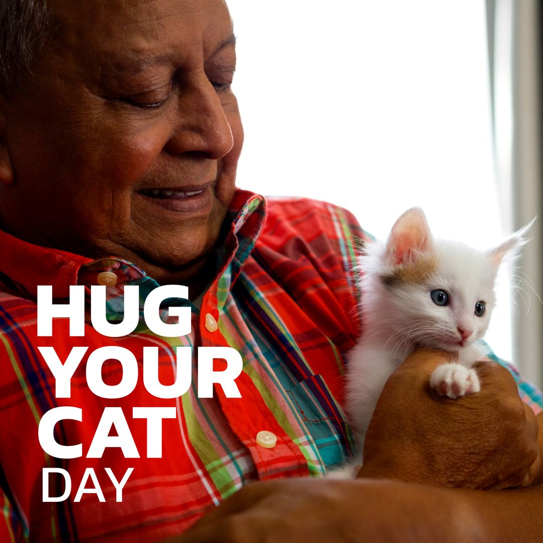 Senior Man Gently Hugging Adorable White Kitten Celebrating Cat Hugging Day