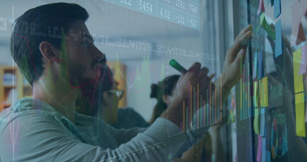 Business Team Analyzing Financial Data Projections on Digital Screen