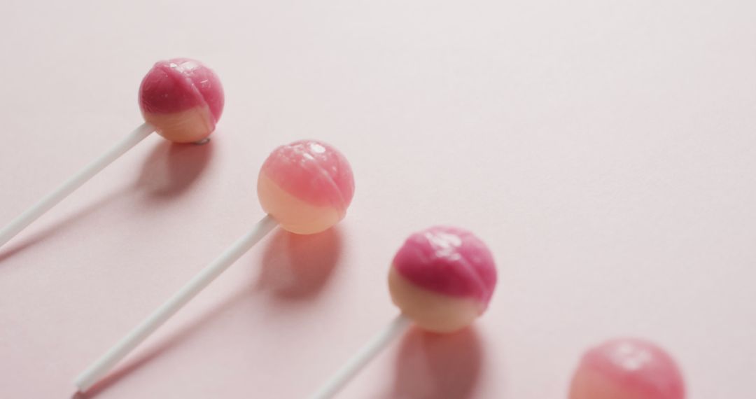 Pink and White Lollipops on Light Pink Background - Free Images, Stock Photos and Pictures on Pikwizard.com