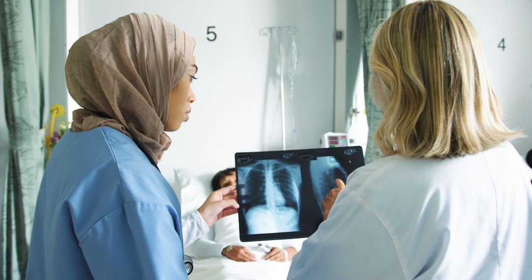 Medical Professionals Analyzing Chest X-rays in Hospital Room - Free Images, Stock Photos and Pictures on Pikwizard.com