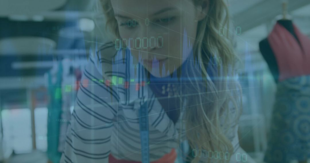 Fashion Designer Analyzing Metrics in Creative Design Studio