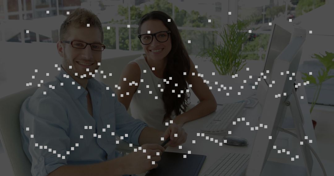 Creative Office Collaboration with Graphics Tablet in Modern Workspace