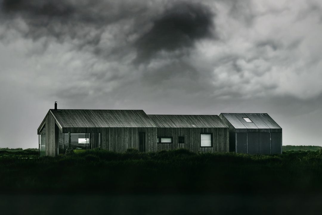 Minimal Modern Timber House Facing Stormy Sky on Remote Grassland, Moody Architecture