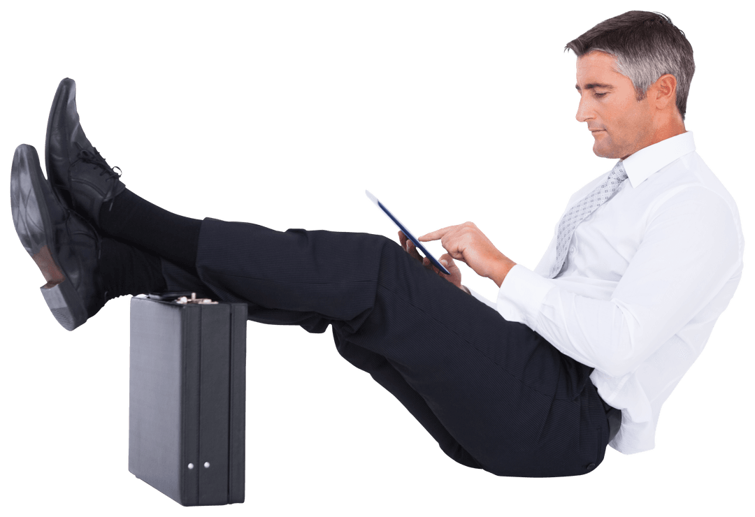 Businessman with Transparent Background Using Tablet on Briefcase