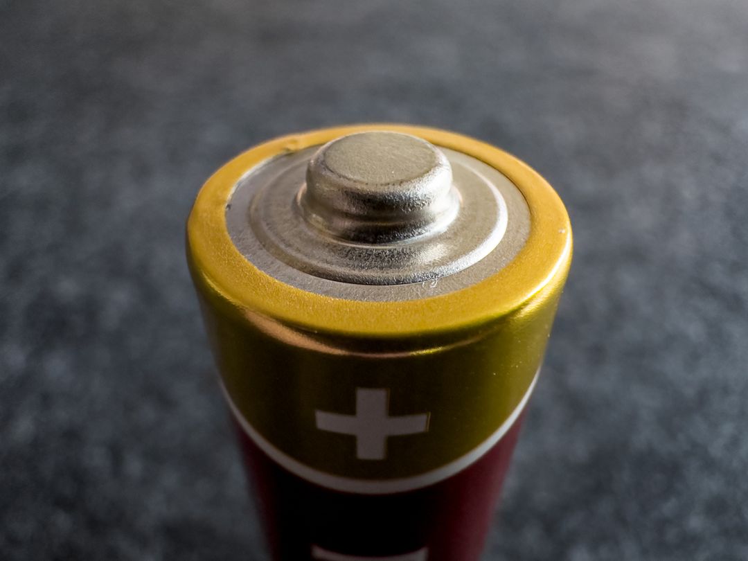 Close-up view of technology alkaline battery positive terminal