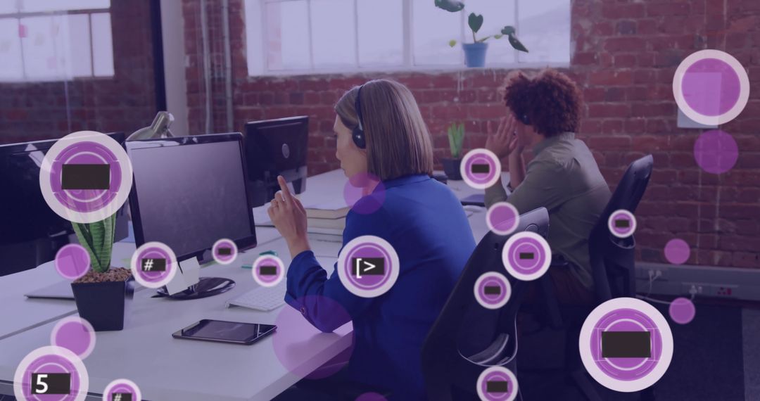 Colleagues Using Phone Headsets in Tech-Infused Modern Office