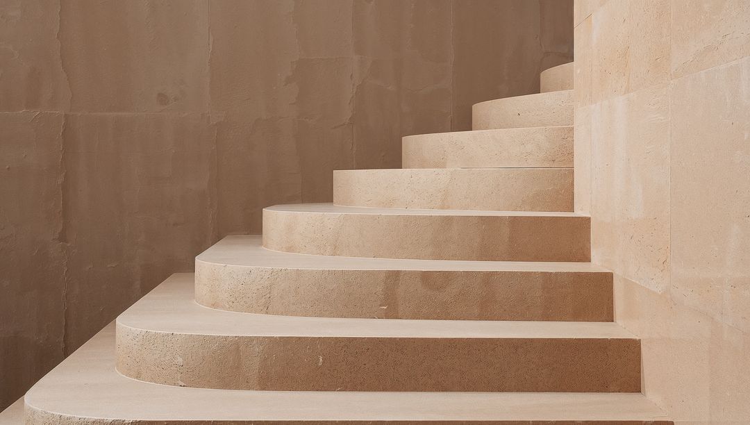 Curved Limestone Staircase Minimalist Interior Wide Rounded Treads Warm Beige Surfaces