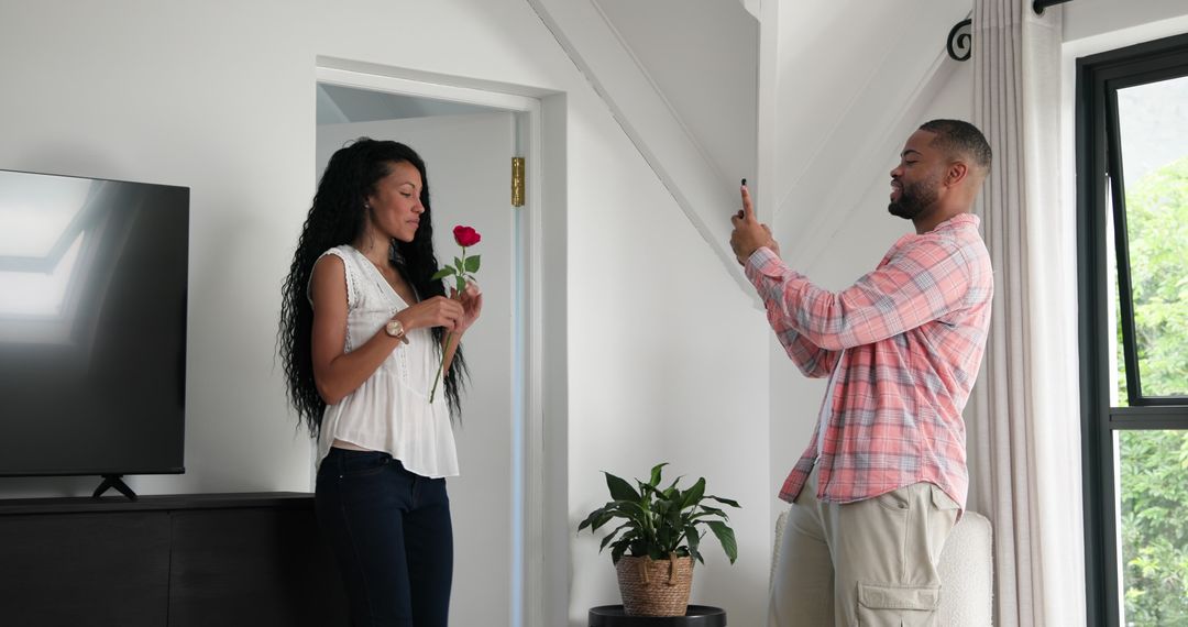 Man Proposing with Rose and Capturing Moment Indoors