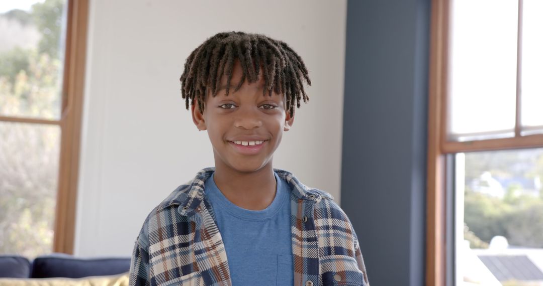 Smiling African American Boy Wearing Plaid Shirt Indoors