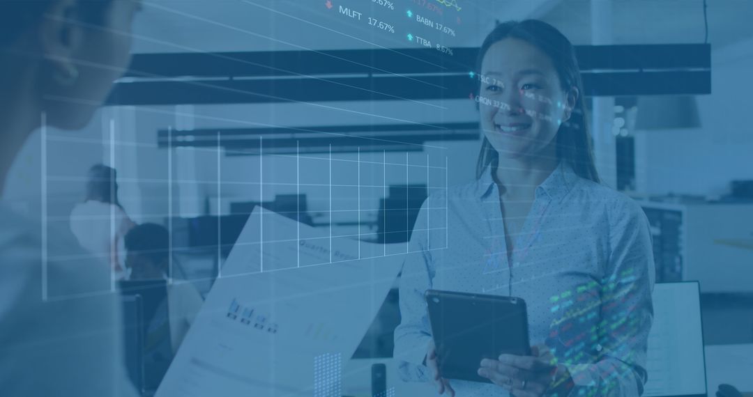 Diverse Businesswomen Analyzing Data with Digital Interfaces