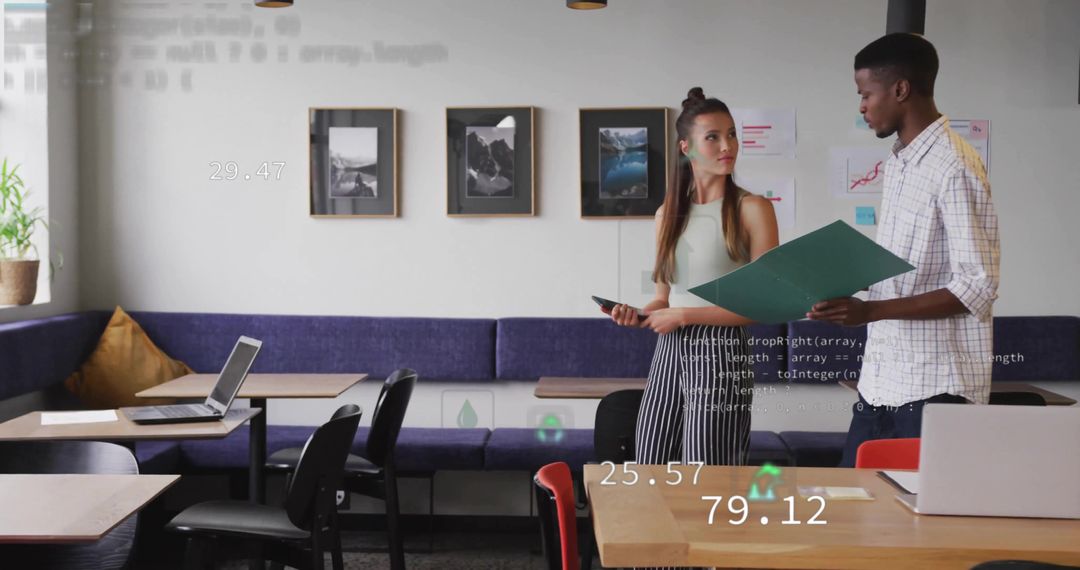 Modern colleagues reviewing analytics and documents in shared lounge workspace