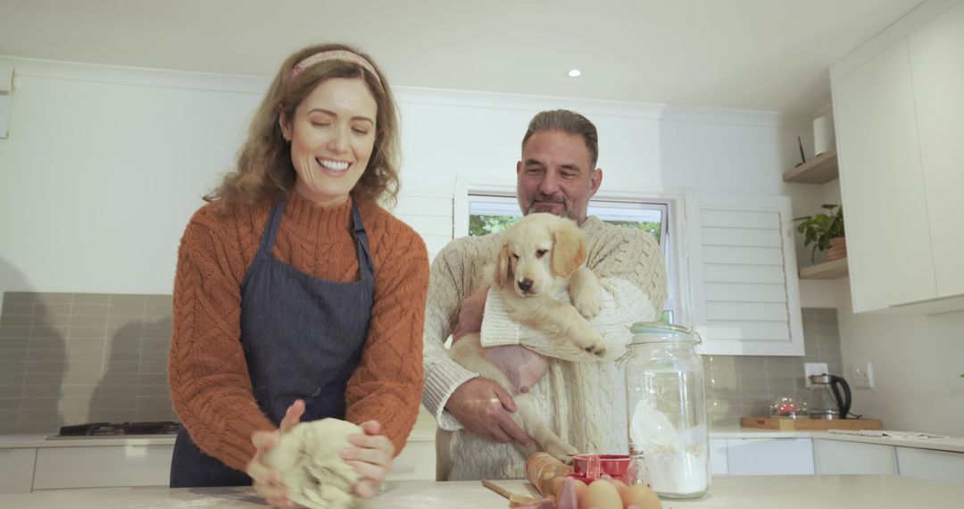 Couple Baking with Golden Retriever Puppy in Homey Kitchen