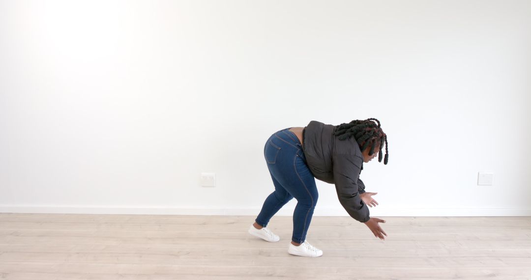 Woman Stretching in Studio for Flexibility and Wellness