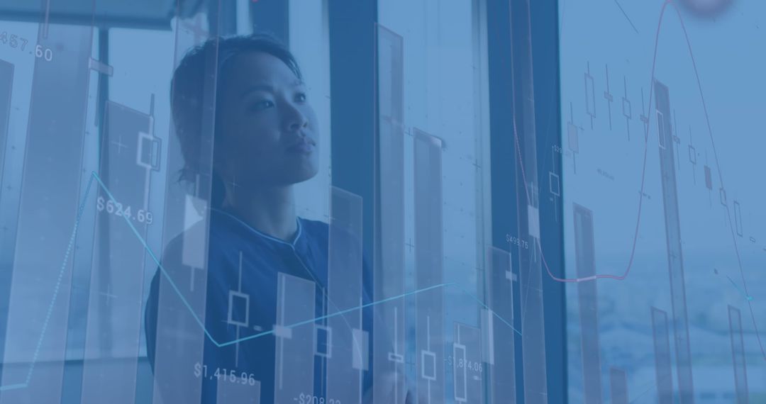 Financial Analyst Examining Virtual Data Charts in Corporate Setting