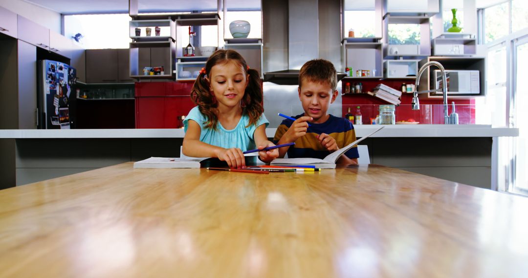 Children Doing Homework in Modern Kitchen - Free Images, Stock Photos and Pictures on Pikwizard.com