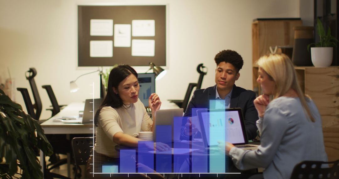 Professionals Collaborating on Financial Data in Modern Office