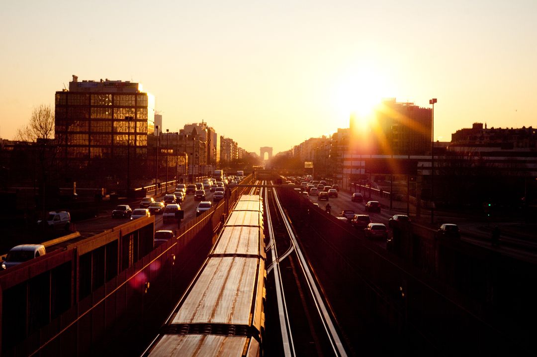 Urban Railway During Sunset with Busy Cityscape - Free Images, Stock Photos and Pictures on Pikwizard.com