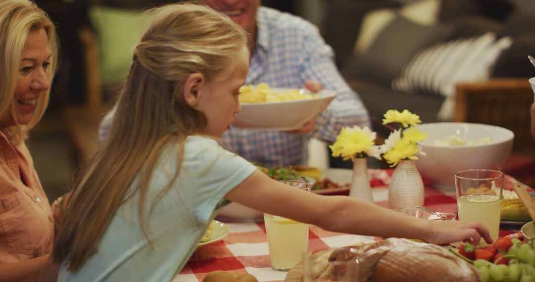 Caucasian Family Sharing Meal Around Dinner Table