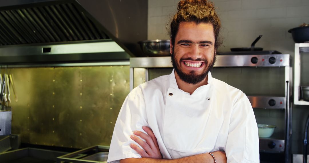 Smiling Chef With Folded Arms In Professional Kitchen - Free Images, Stock Photos and Pictures on Pikwizard.com