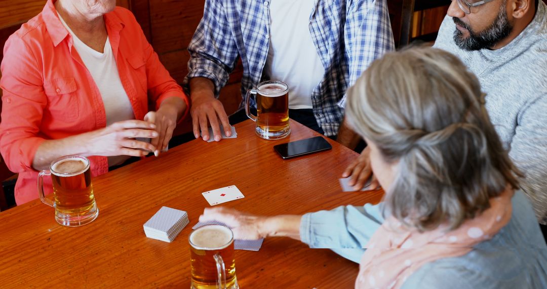 Group of Friends Enjoying Card Game at Pub - Free Images, Stock Photos and Pictures on Pikwizard.com