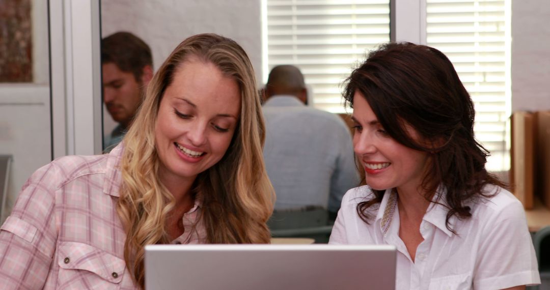 Women Collaborating on Laptop in Office Meeting Room - Free Images, Stock Photos and Pictures on Pikwizard.com