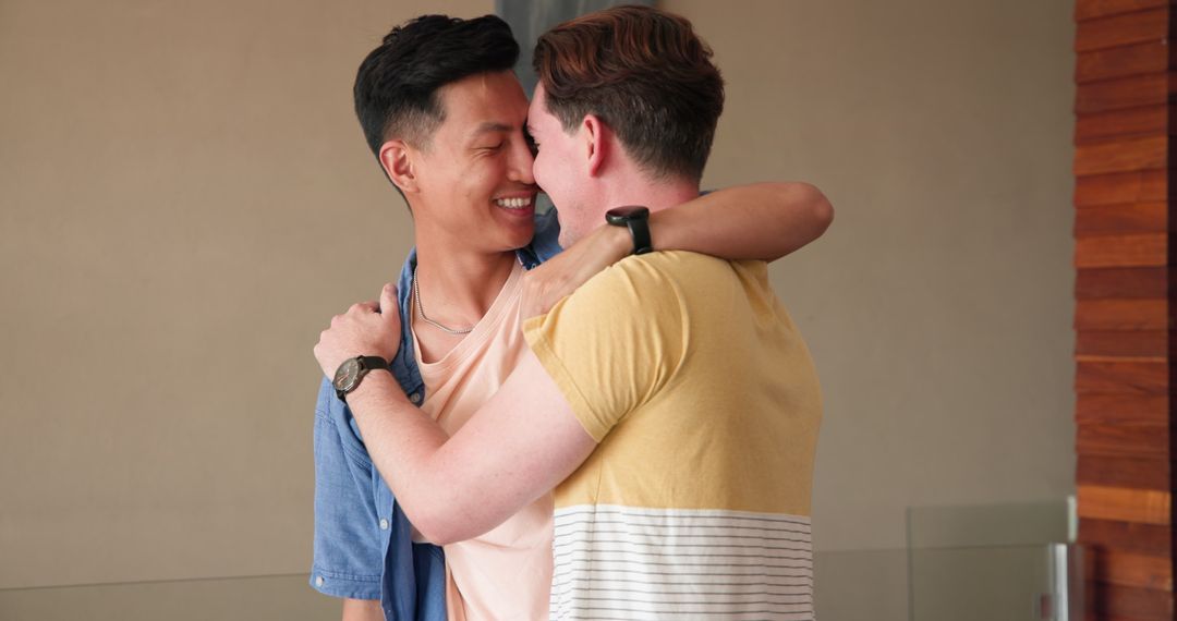 Cheerful Couple Embracing In Diverse Relationship At Home