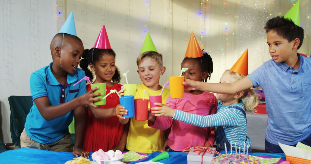 Children Celebrating Birthday Party with Colorful Hats and Decorations - Free Images, Stock Photos and Pictures on Pikwizard.com