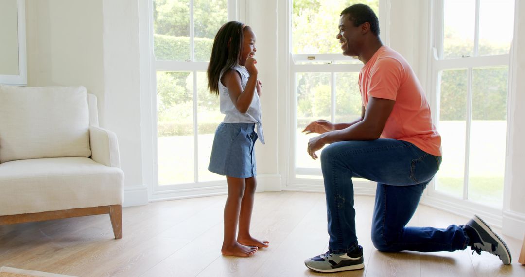 Father and Daughter Deep in Conversation at Home