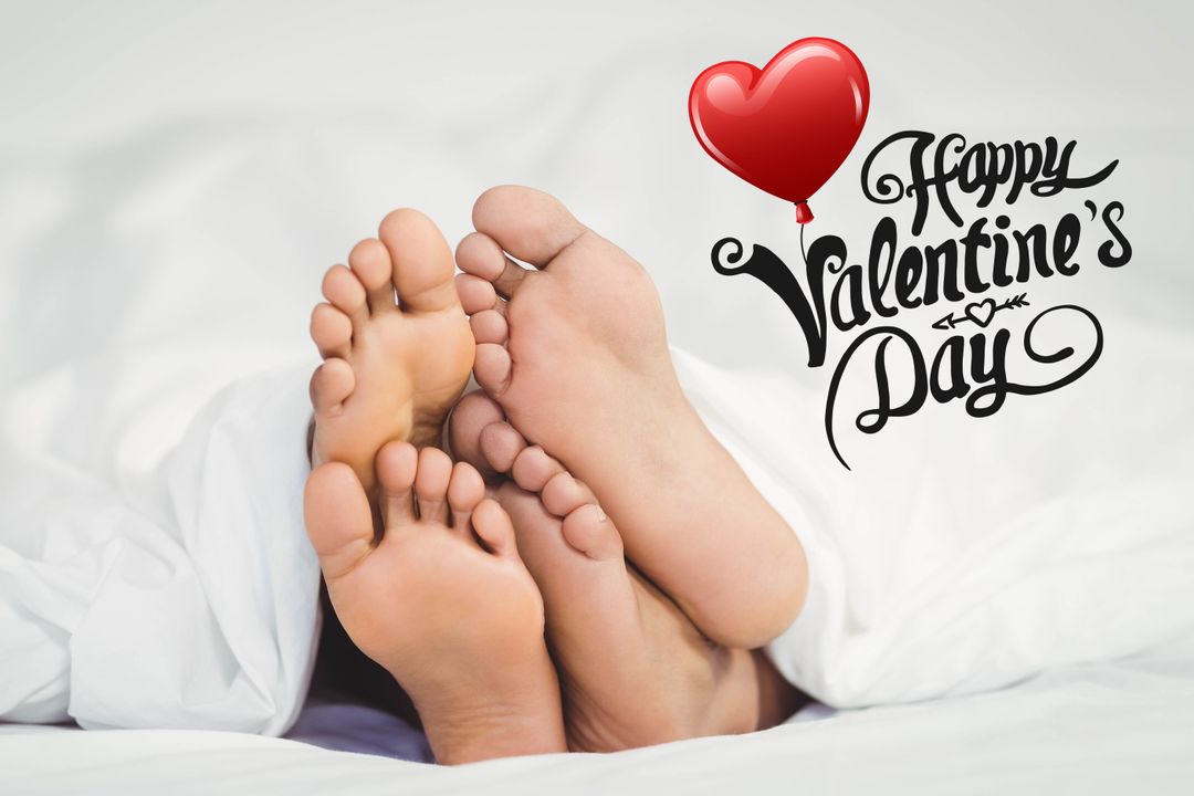 Romantic Couple Feet Under Sheets for Valentine's Day