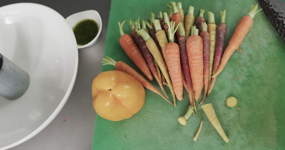 Fresh Organic Carrots and Yellow Bell Pepper on Cutting Board - Free Images, Stock Photos and Pictures on Pikwizard.com