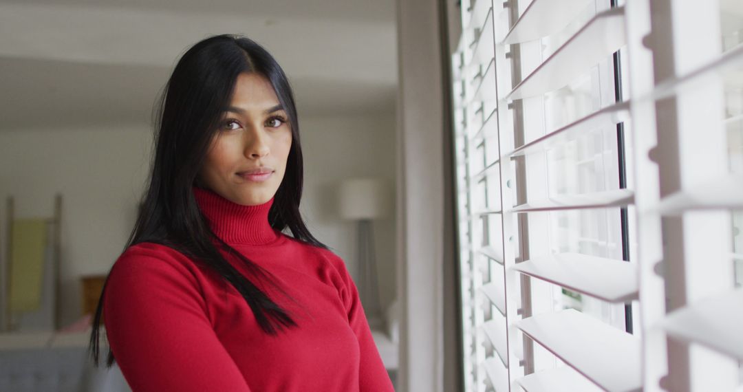 Image of happy of biracial woman standing at window - Free Images, Stock Photos and Pictures on Pikwizard.com