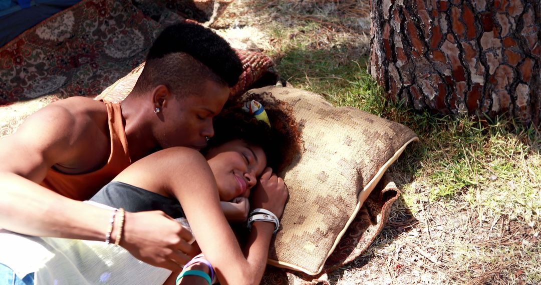Affectionate Couple Relaxing Under Tree Shade Outdoors
