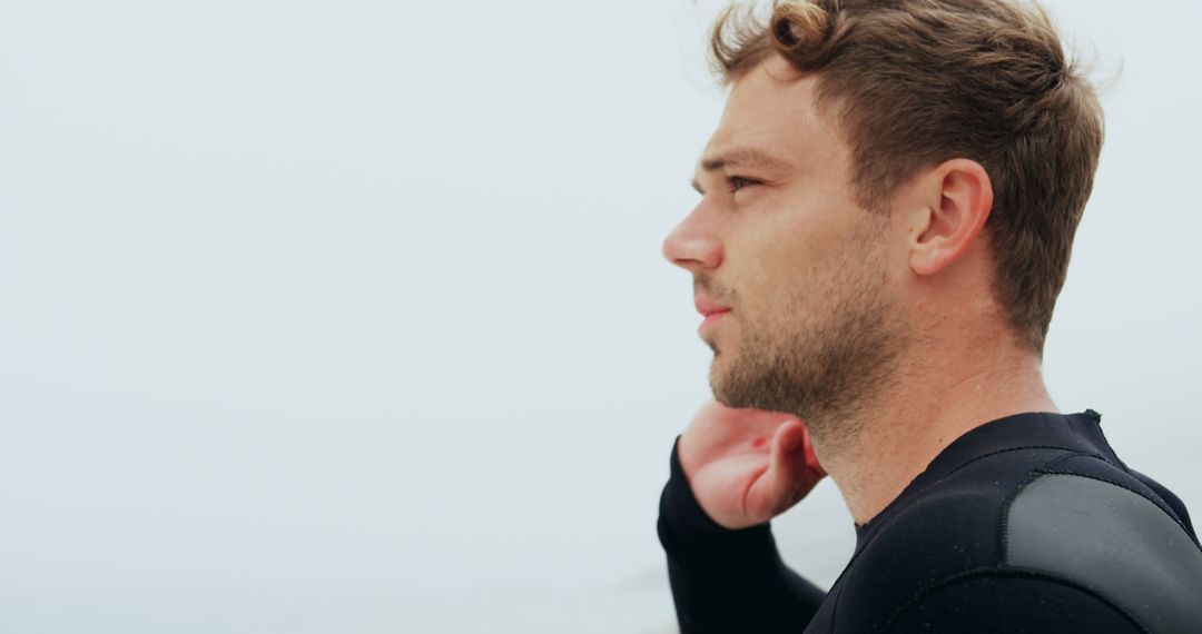 Serene Male Surfer Enjoying Ocean View