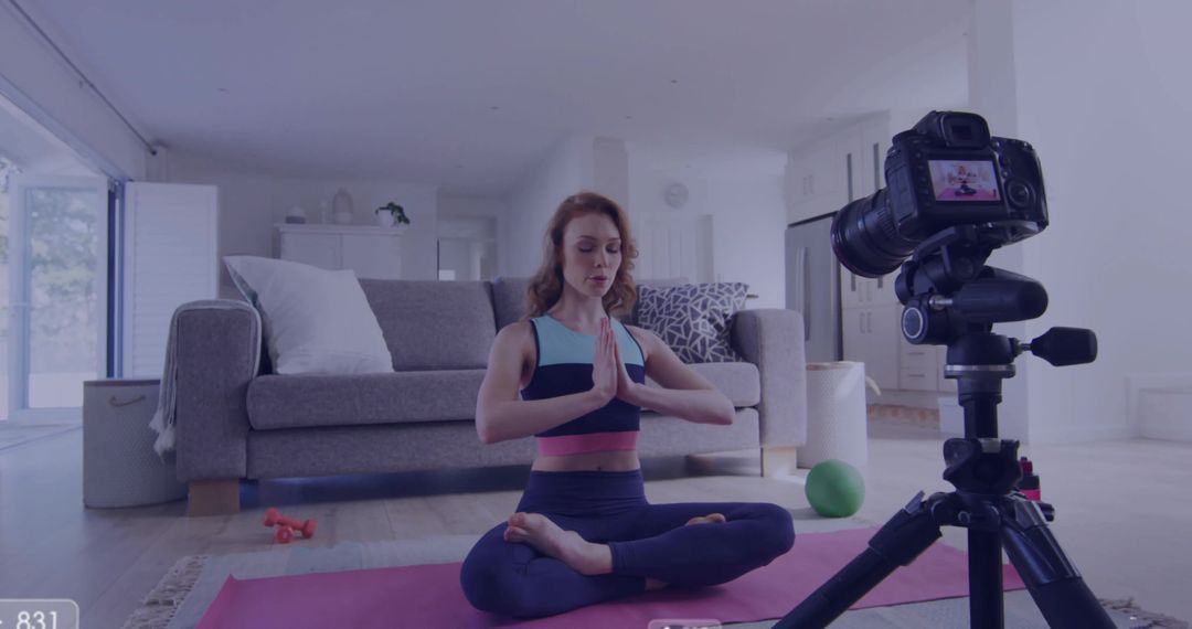Woman Filming Yoga Session at Home with DSLR Camera