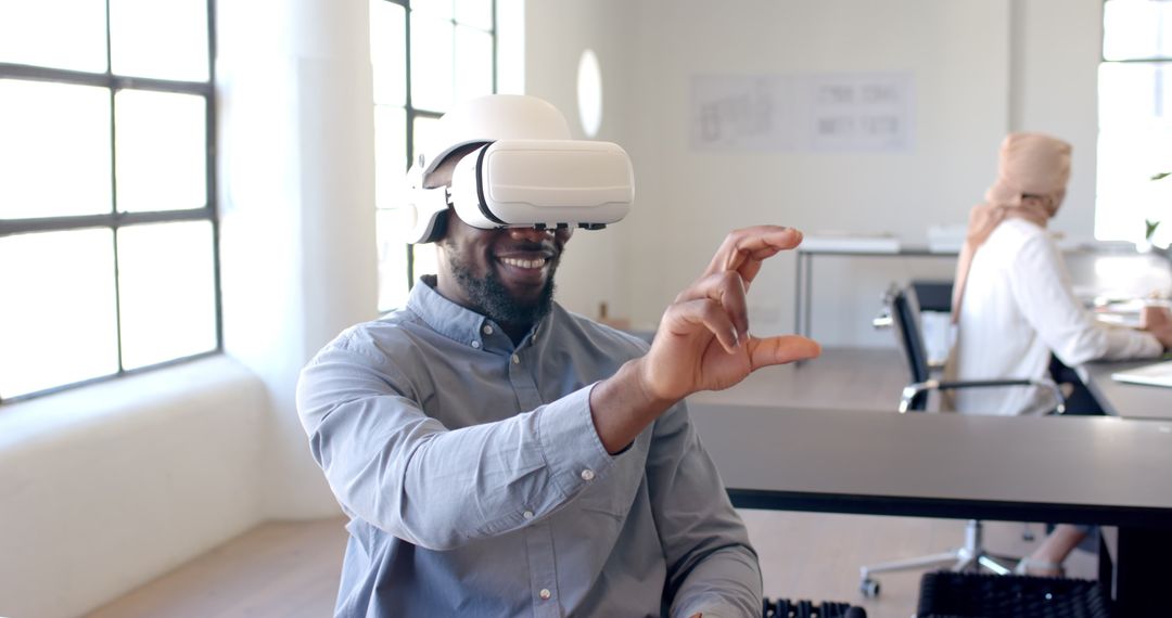 Man Wearing VR Headset Interacting with Virtual Environment in Office
