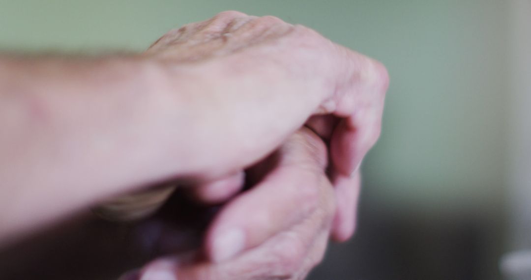 Close-Up of Elderly Hands Clasped Together in Deep Connection - Free Images, Stock Photos and Pictures on Pikwizard.com