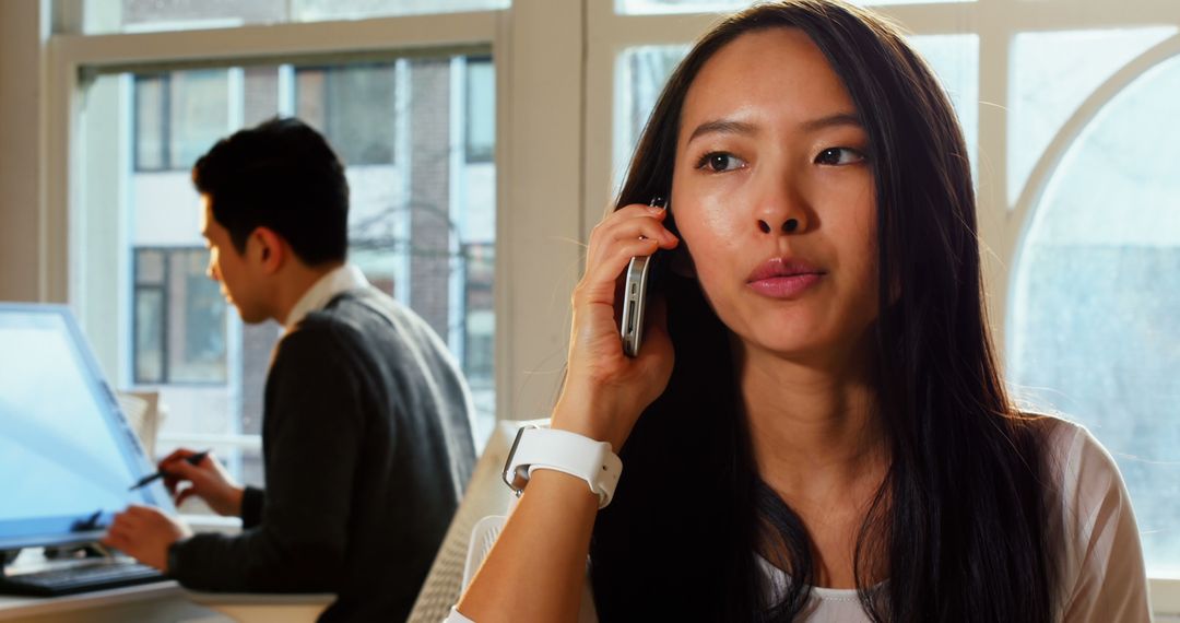 Confident Executive Woman in Office on Phone Call